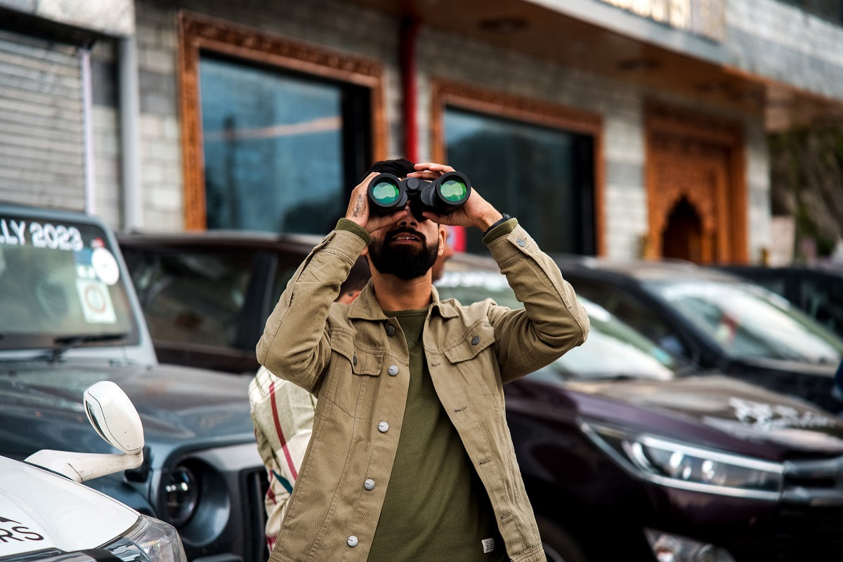 Men with hawk binoculars